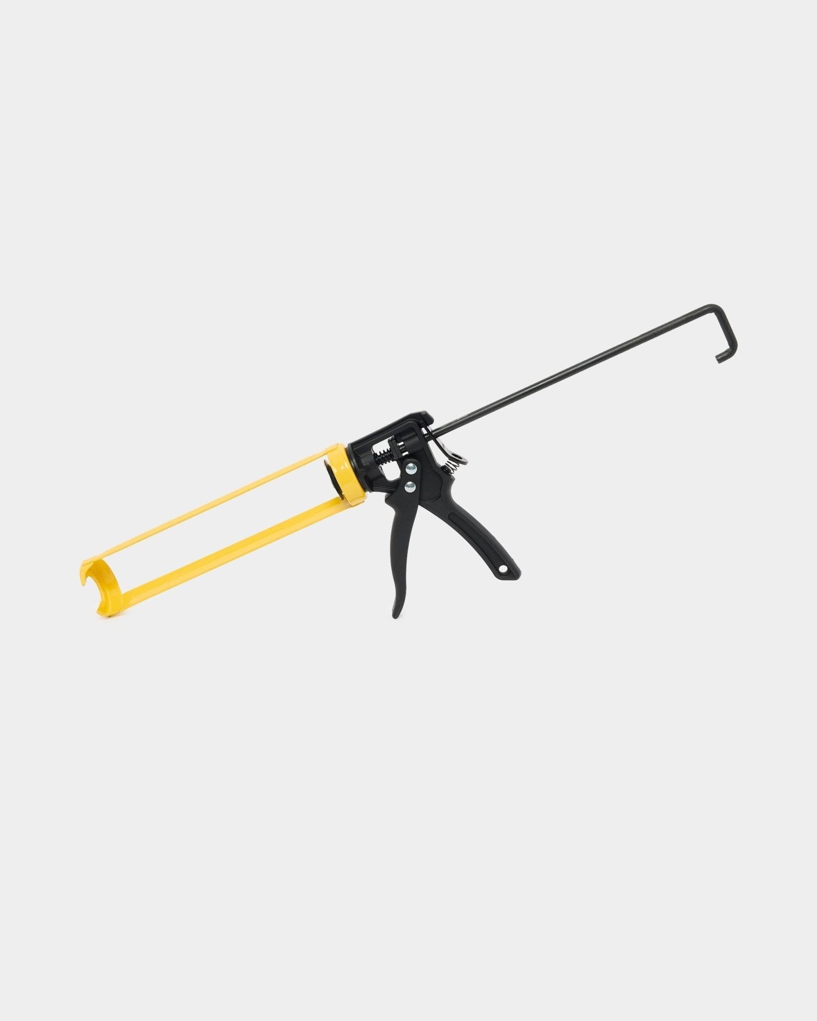 WoodUpp fugemassepistol (290 ml) for Akupanel Montering, med et gult og black metallhåndtak og avtrekker, brukt til å dosere monteringslim for akustiske paneler.