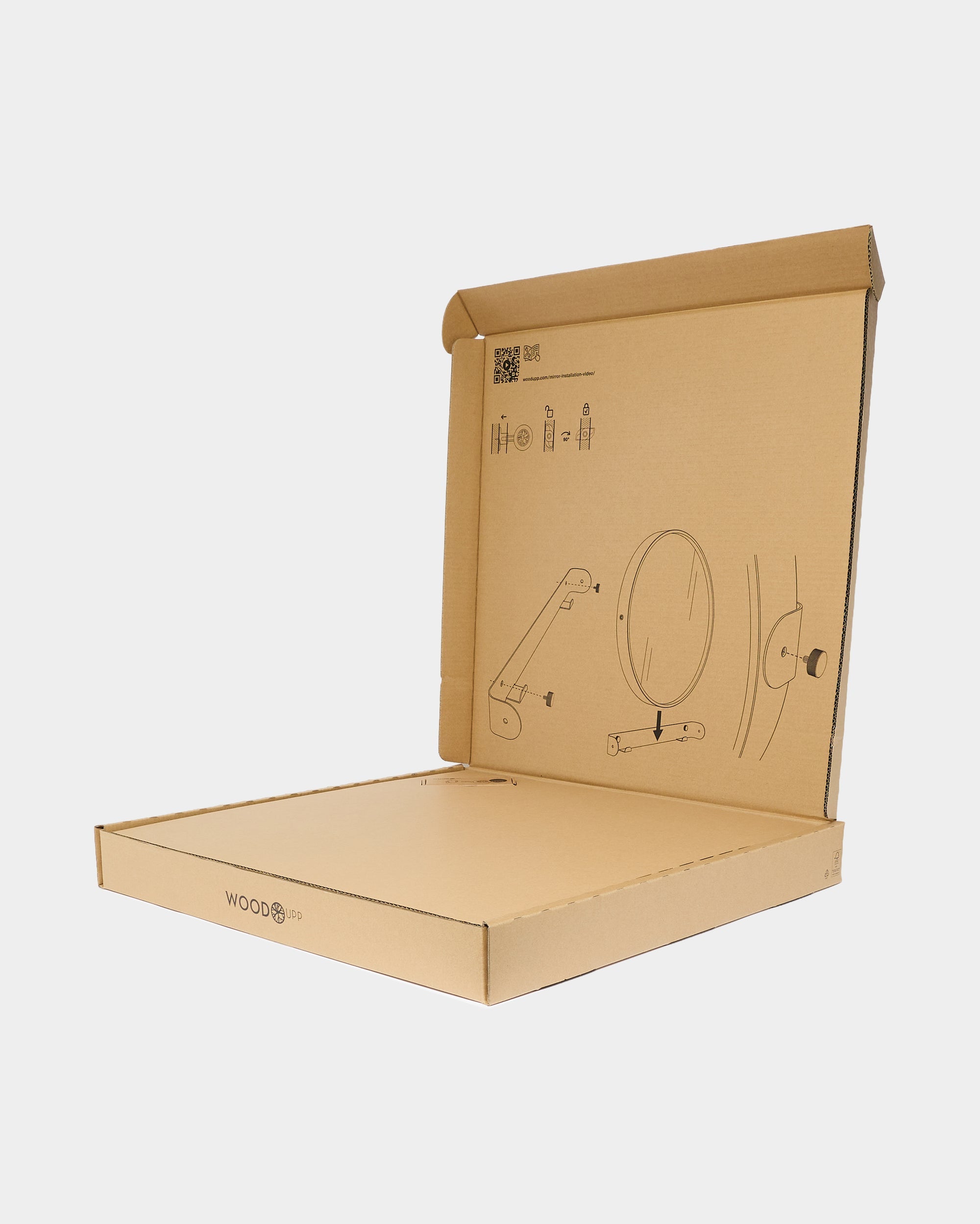 Open cardboard box with minimalist black line instructions printed inside the lid and the eco-friendly WoodUpp logo on the front flap, ready for acoustic panel assembly.